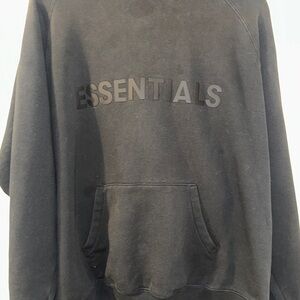Two used black Essentials hoodies